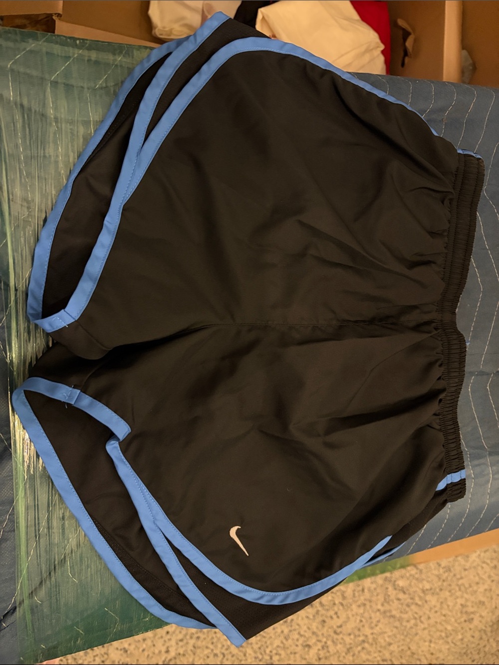 Nike Women’s Black Athletic Shorts with Blue Trim